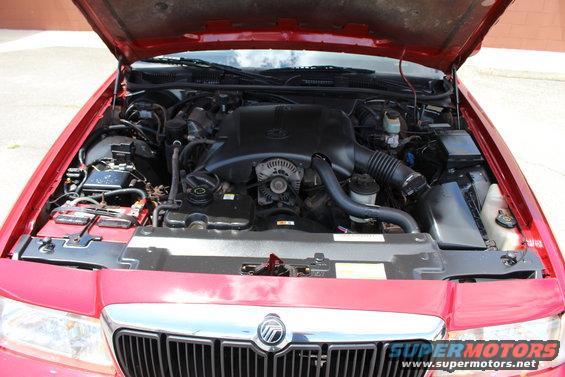 Red 2002 Mercury Grand Marquis engine bay with hood open