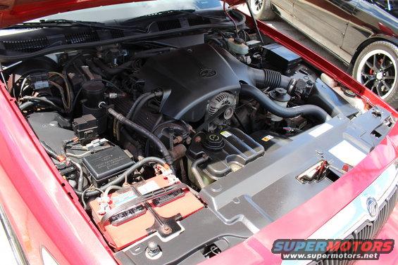 2002 Mercury Grand Marquis engine bay with red exterior paint