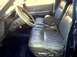 1987 Ford Crown Victoria LTD - Interior view of a 1987 Ford Crown Victoria LTD, bench seats and the steering column.