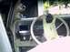 1987 Ford Crown Victoria LTD - The interior of a car is shown, a steering wheel, dashboard with wood grain accents, and additional gauges on the A-pillar.