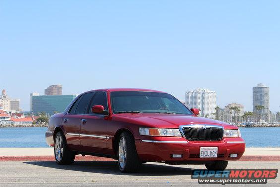 Red 2002 Mercury Grand Marquis with California plates 'EVIL MGM'