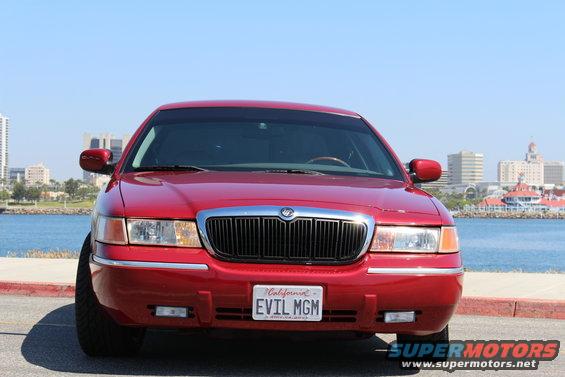 Red 2002 Mercury Grand Marquis front view with custom 'EVIL MGM' license plate