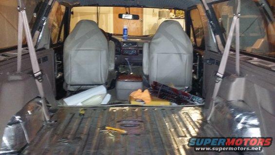 Interior view of a 1994 Ford Bronco with soundproofing material installed