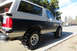 1989 Ford Bronco - This 1989 Ford Bronco features a two-tone paint scheme and aggressive off-road tires.