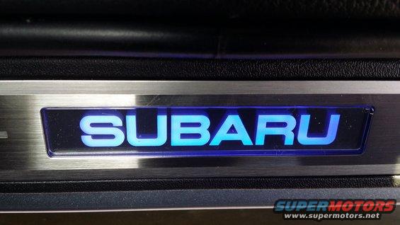 Door sill plate with illuminated SUBARU lettering