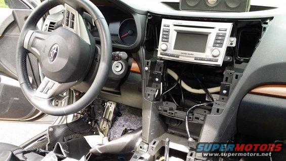 2014 Subaru Outback interior with dashboard panels removed around the stereo