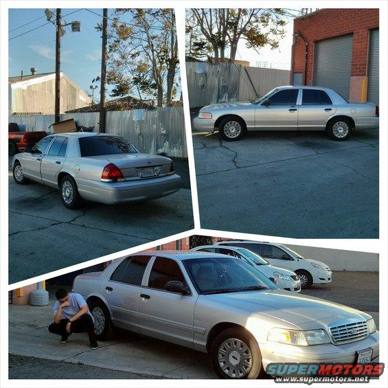 Silver 2004 Ford Crown Victoria parked outside, with another car behind it