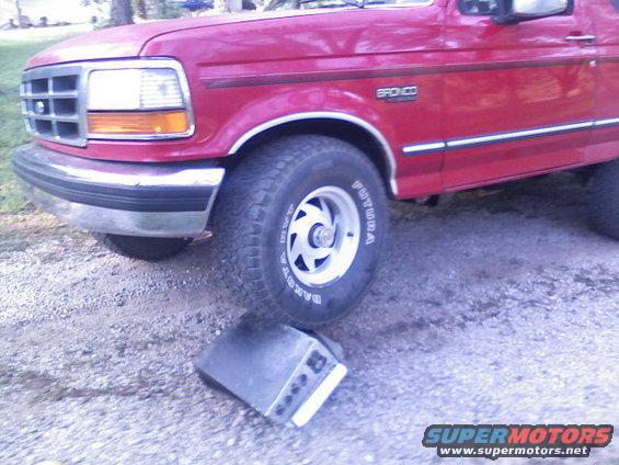 Red 1992 Ford Bronco front quarter view with chrome bumper and 'Bronco' badging