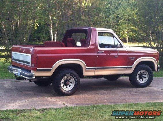 Red and tan 1986 Ford Bronco, 3/4 front view