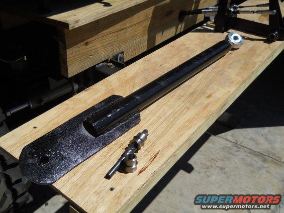 Black metal suspension component and hardware on wooden planks