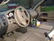 2007 Ford F-150 - The interior of a 2007 Ford F-150 pickup truck, the dashboard, steering wheel, and center console with a drink and a bottle of Mountain Dew.