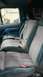 1994 Ford Bronco - The interior of a 1994 Ford Bronco features blue and gray cloth seats with visible seatbelts.