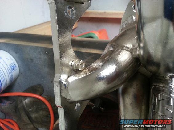 Exhaust manifold with a bolt and bracket