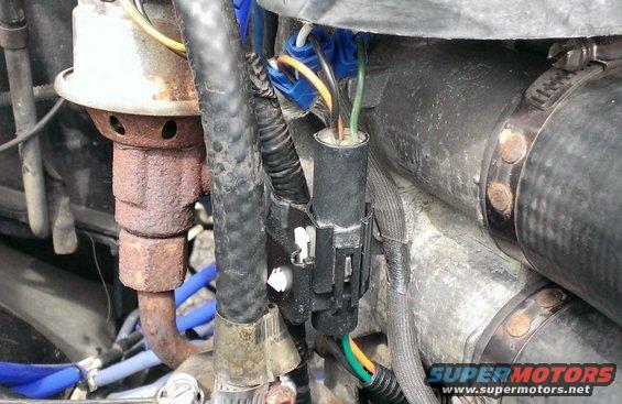 New TPS connector and testing configuration tucked way. After this picture was taken, gaps in the splice connections and the ends of the ports were sealed with silicone glue, which can be easily cut out to insert multi-meter probes.