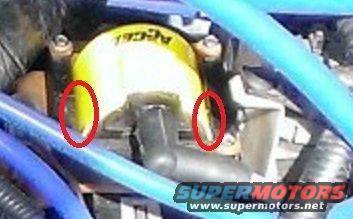 While troubleshooting a possible misfire, I noticed the indistinguishable blue spark in between the coil and its mounting base (circled areas).