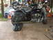 1998 Honda Shadow VT750C - A motorcycle is parked inside a garage, with tools and another motorcycle visible.
