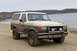 1989 Ford Bronco - This 1987 Ford Bronco is covered in mud after an off-road excursion near a body of water.
