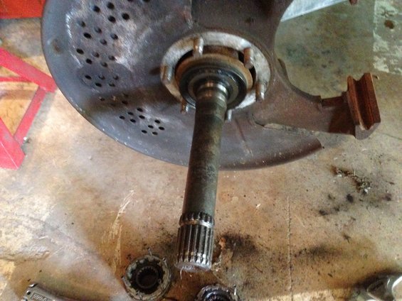 Disassembled wheel hub assembly with brake rotor and axle shaft