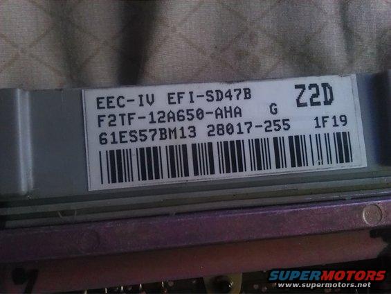 Close-up of a Ford EEC-IV EFI computer module with part numbers F2TF-12A650-AHA and 61ES57BM13