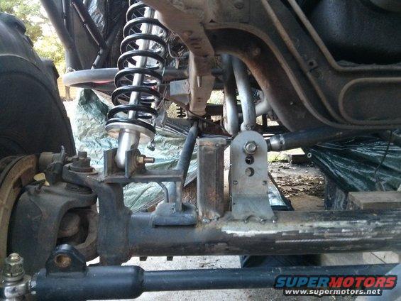 Custom suspension component with coilover shock absorber and linkage
