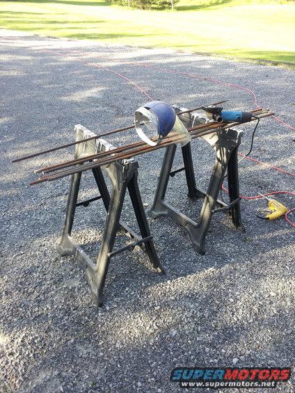 20140511_180223.jpg 1/2&quot; rebar and a 4.5&quot; angle grinder using type 27 depressed center cutoff wheels... cut in half each rebar with a flat 90* cut, then cut those halves in half with a steep angle... now you have a stake with a flat end to hammer in