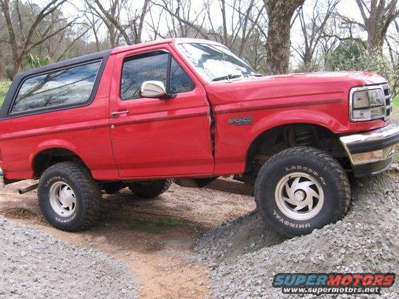 1992 Ford Bronco on a gravel incline, side view