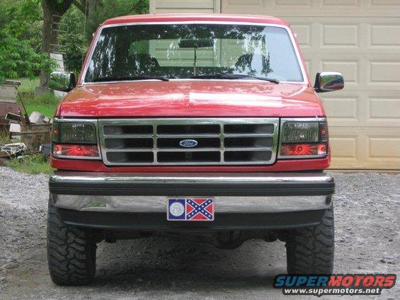 Red 1992 Ford Bronco front view with chrome grille and Ford badge