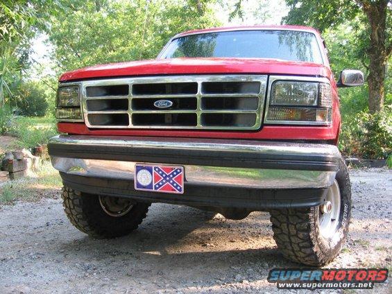 Red 1992 Ford Bronco front view with chrome grille and bumper