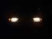 1993 Ford Escort - the headlights at night.