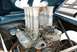1968 Ford Mustang - Engine bay a V8 engine with an intake manifold fitted with eight individual carburetors and velocity stacks.