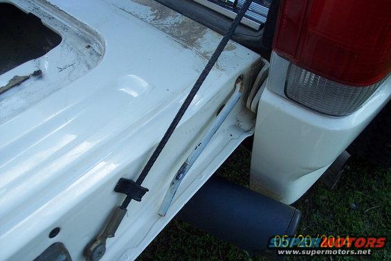 White 1990 Ford Bronco tailgate torsion bar mechanism