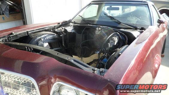 1972 Ford Ranchero engine bay with engine removed, maroon exterior