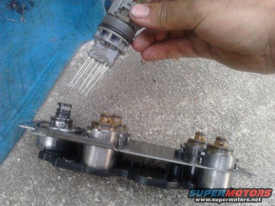 p82a02451.jpg Installing a Transgo shift kit into its E4OD. was going smoothly till I had to take the solenoid pack off. the connector going through the case just would not come out. eventually it broke off from the solenoid pack. even then took another 15mins to get the connector out. FML