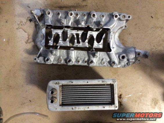 Aluminum supercharger manifold and intercooler on concrete floor