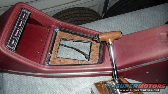 Interior console with woodgrain trim and automatic shifter