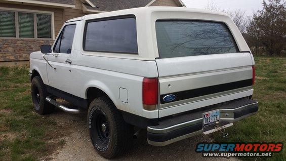 1990 Ford Bronco rear view, white with removable hardtop, parked outdoors