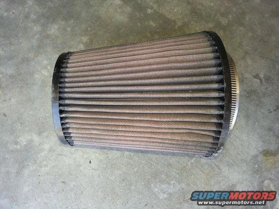 Used air filter with metal clamp