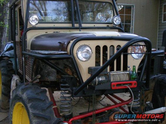 Modified off-road vehicle with large tires and winch