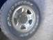1978 Ford Bronco - This photo shows a close-up of a tire and wheel assembly, not a specific vehicle model or year.