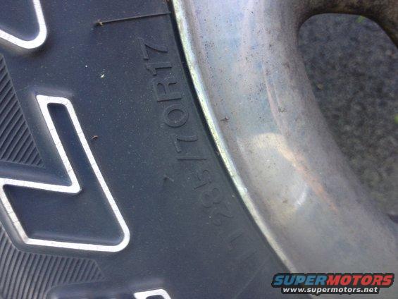 Tire sidewall with size 285/70R17 and a chrome wheel