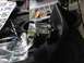 1988 Ford Bronco - Aftermarket air intake part with chrome tubing and black plastic housing, next to tools and instructions.