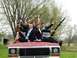 1978 Ford Bronco - Five young men in suits pose with rifles on the hood of a red Ford truck.