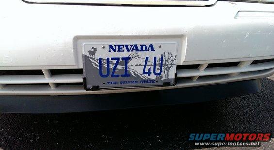 White car front bumper with Nevada license plate UZT 4U