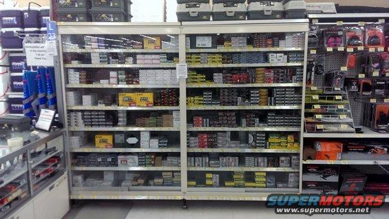 shelves stocked with boxes of ammunition and other hunting/fishing supplies