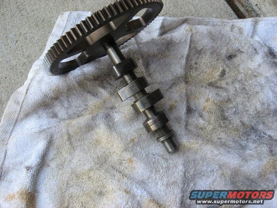 Camshaft with gear on a stained towel
