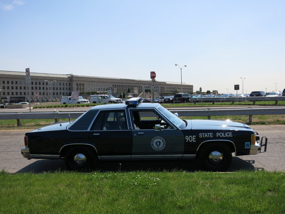 Side view of a 1991 Ford Crown Victoria police car with "STATE POLICE" text