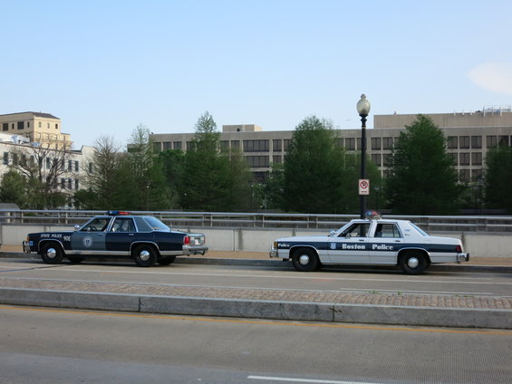1991 Ford Crown Victoria police cars, one Boston Police, one State Police, parked side-by-side