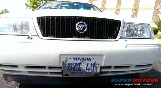 White 2000 Mercury Grand Marquis front grille with Mercury logo and Nevada license plate UZI 4U