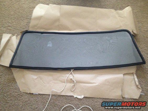 1965 Mustang windshield with nylon rope for installation
