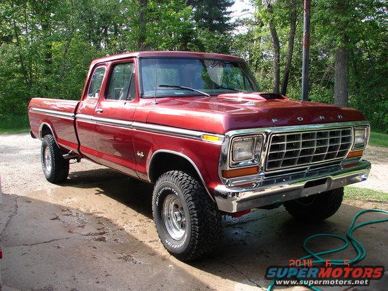 1979 Ford F-150 Supercab pickup truck, red paint, chrome grille, aftermarket wheels